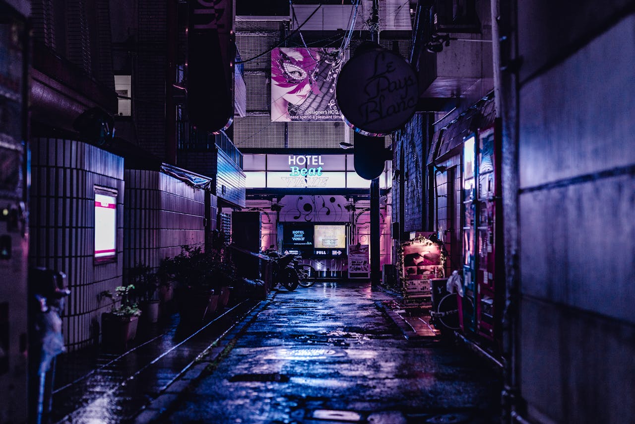A vivid night scene capturing a wet alley in Tokyo with neon lights and urban architecture.